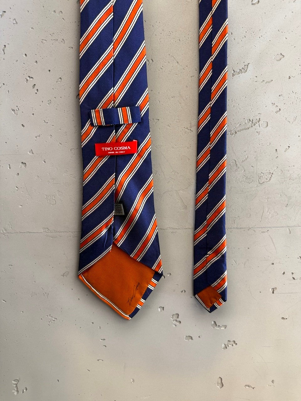 BERLIN VINTAGE CORNER Tino Cosma navy blue, orange, and white striped silk necktie with signature orange tipping.