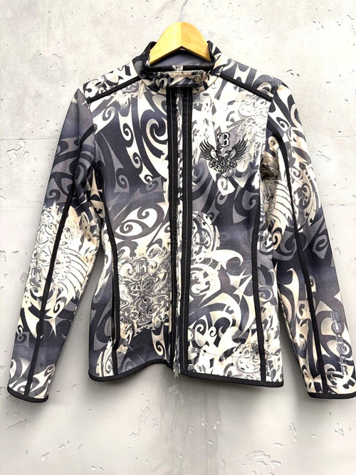 BERLIN VINTAGE CORNER grey, black, and cream tribal print zip-up jacket with embroidered chest detail and stand-up collar.