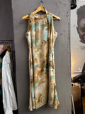 BERLIN VINTAGE CORNER sleeveless midi dress with tropical print in beige, tan, and turquoise. Lightweight flowing fabric.