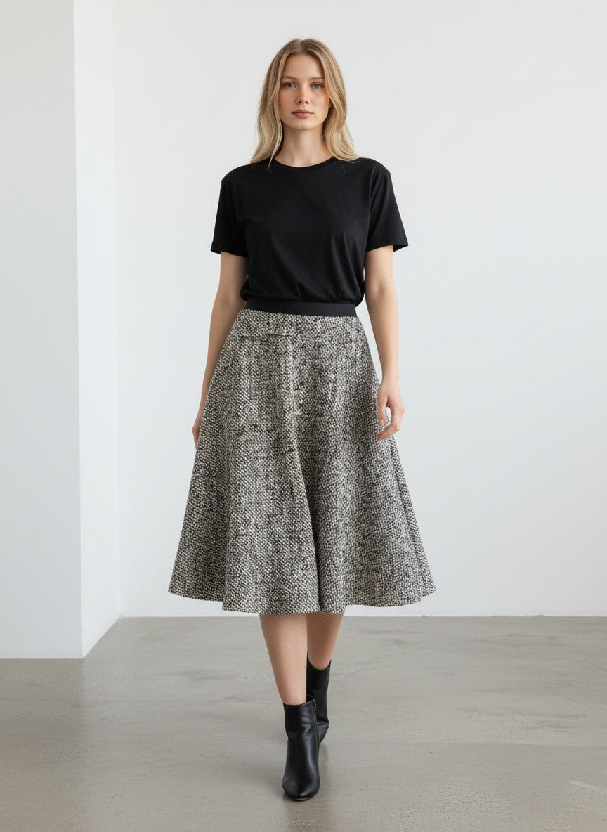 BERLIN VINTAGE CORNER black and cream marled tweed A-line skirt with black waistband and back zipper.
