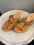 BERLIN VINTAGE CORNER tan leather UGG espadrille wedge sandals with embossed straps and buckle closure.