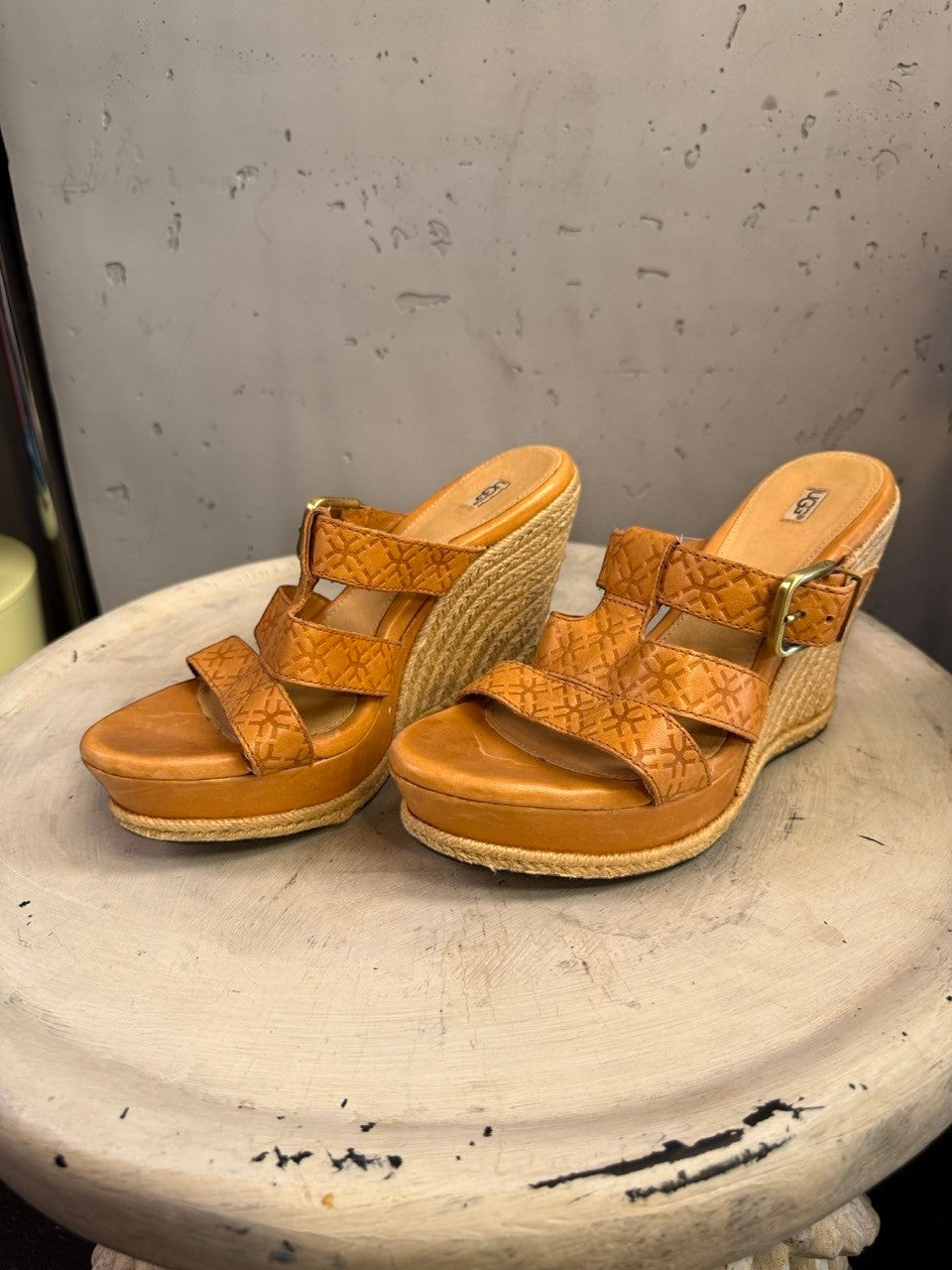 BERLIN VINTAGE CORNER tan leather UGG wedge espadrille sandals with embossed straps and buckle closure.