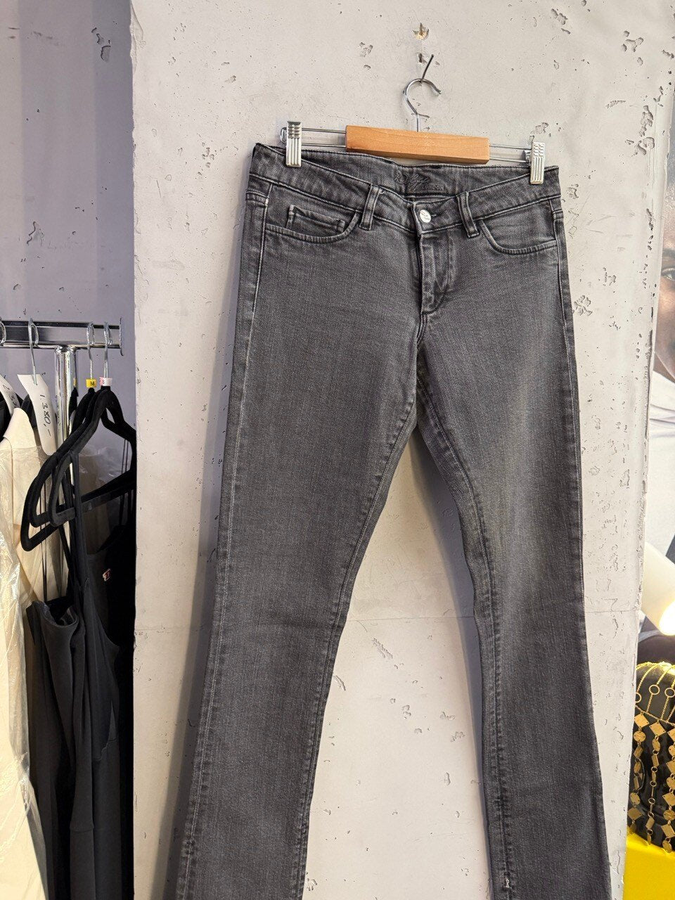 Grey skinny jeans, hem slit with stud