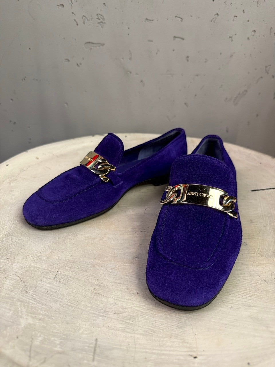 BERLIN VINTAGE CORNER Jimmy Choo deep violet suede loafers with polished gold-tone chain hardware on the vamp.