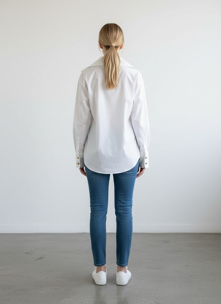 BERLIN VINTAGE CORNER white cotton blend button-up blouse with tonal embroidery and ruched cuffs with gold buttons.