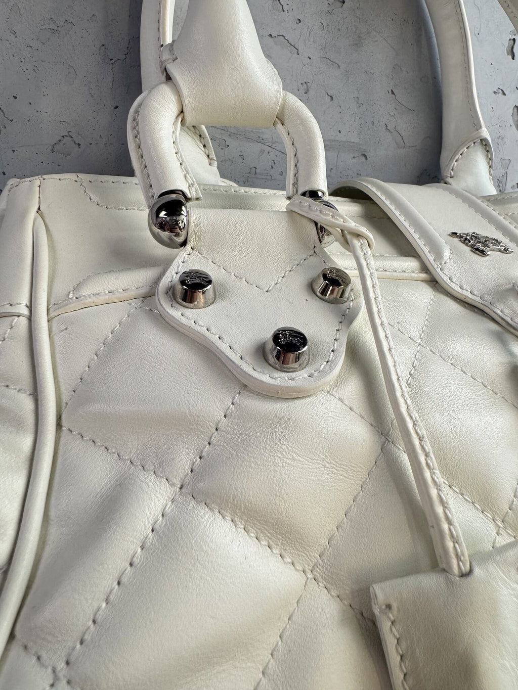 BERLIN VINTAGE CORNER white quilted leather Burberry handbag with silver-tone hardware and signature stud details.