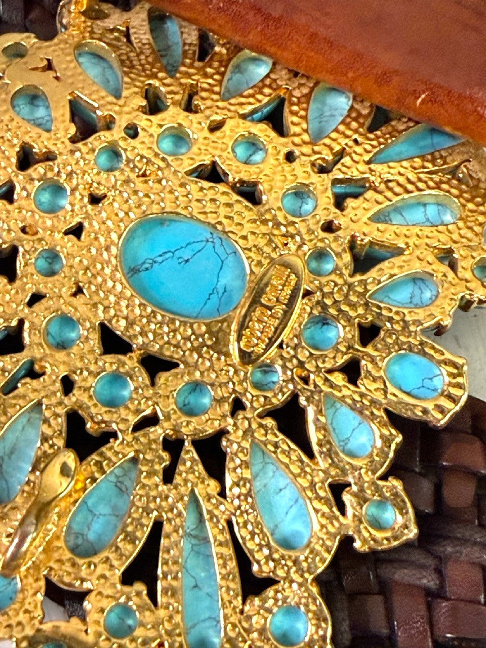 BERLIN VINTAGE CORNER dark brown woven leather belt with ornate gold-tone buckle and turquoise stones.