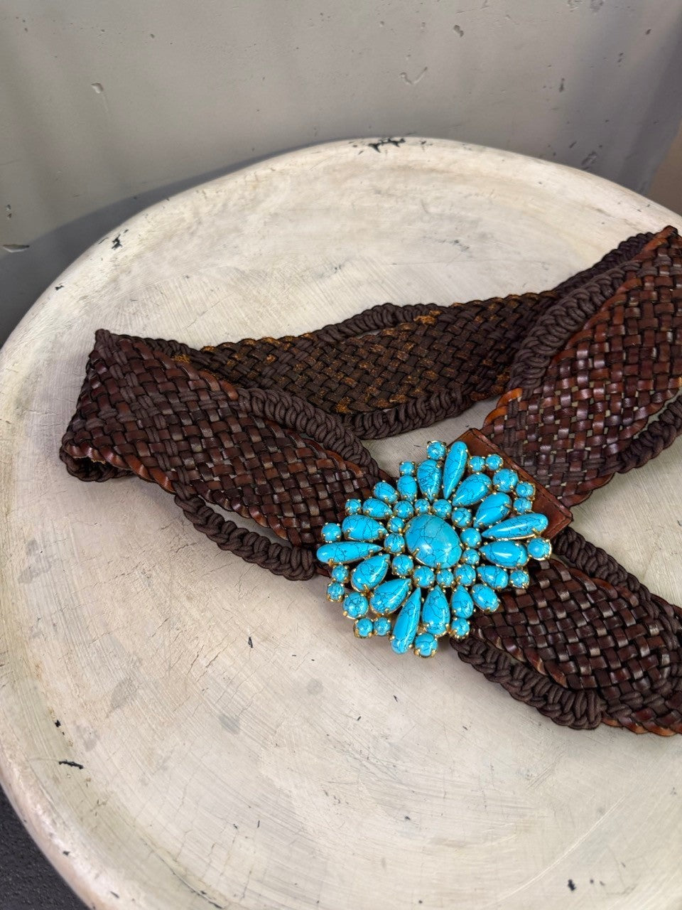 BERLIN VINTAGE CORNER dark brown woven leather belt with ornate gold-tone buckle and turquoise stones.
