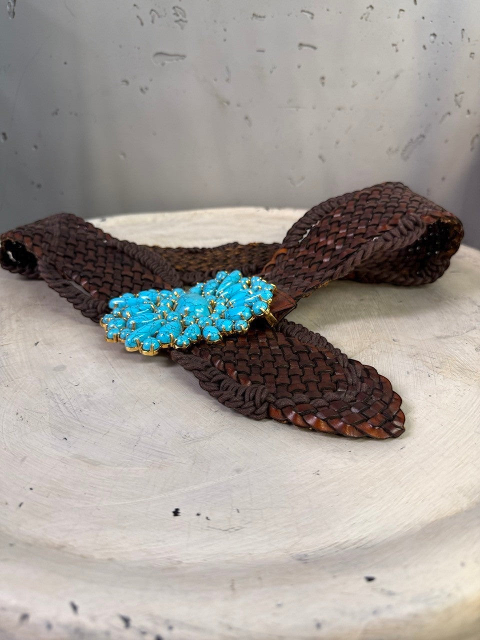 BERLIN VINTAGE CORNER dark brown woven leather belt with ornate gold-tone buckle featuring turquoise stones.