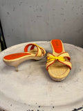 BERLIN VINTAGE CORNER woven raffia slide heeled sandals with orange trim, yellow bow accent, and wooden heel.
