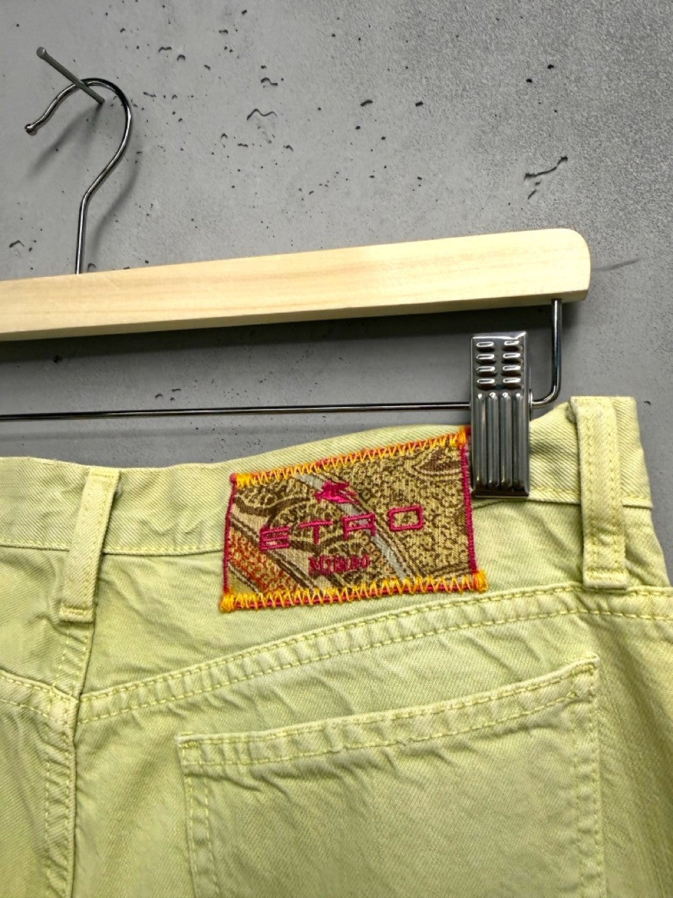 BERLIN VINTAGE CORNER light yellow denim flare jeans with embroidered paisley detail and pink hardware.