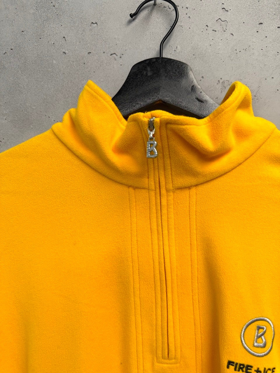 BERLIN VINTAGE CORNER yellow fleece quarter zip pullover with embroidered logo and zipper pull.
