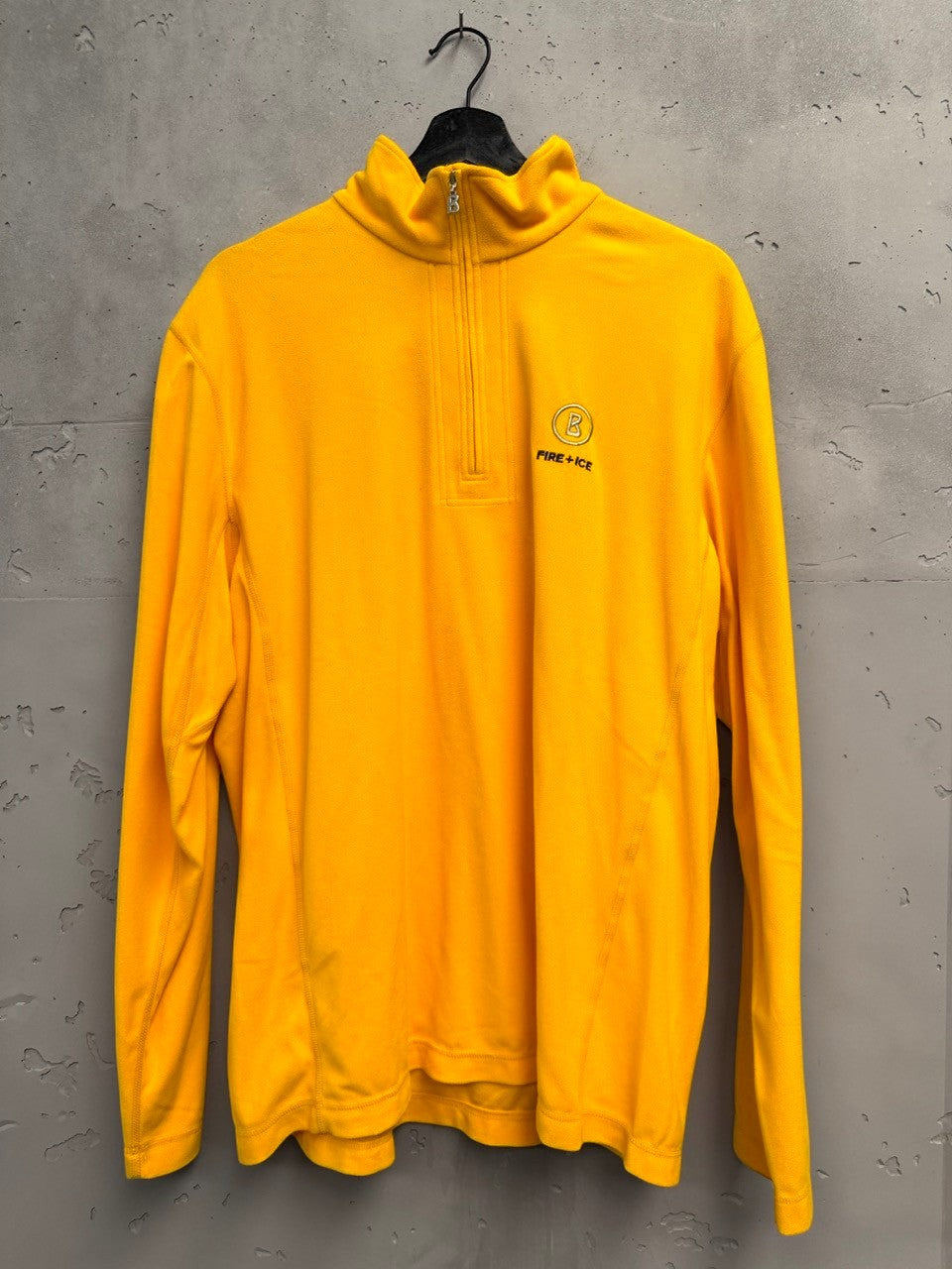 BERLIN VINTAGE CORNER yellow fleece quarter zip pullover with embroidered logo. Soft, breathable, and insulated for outdoor adventures or casual wear.