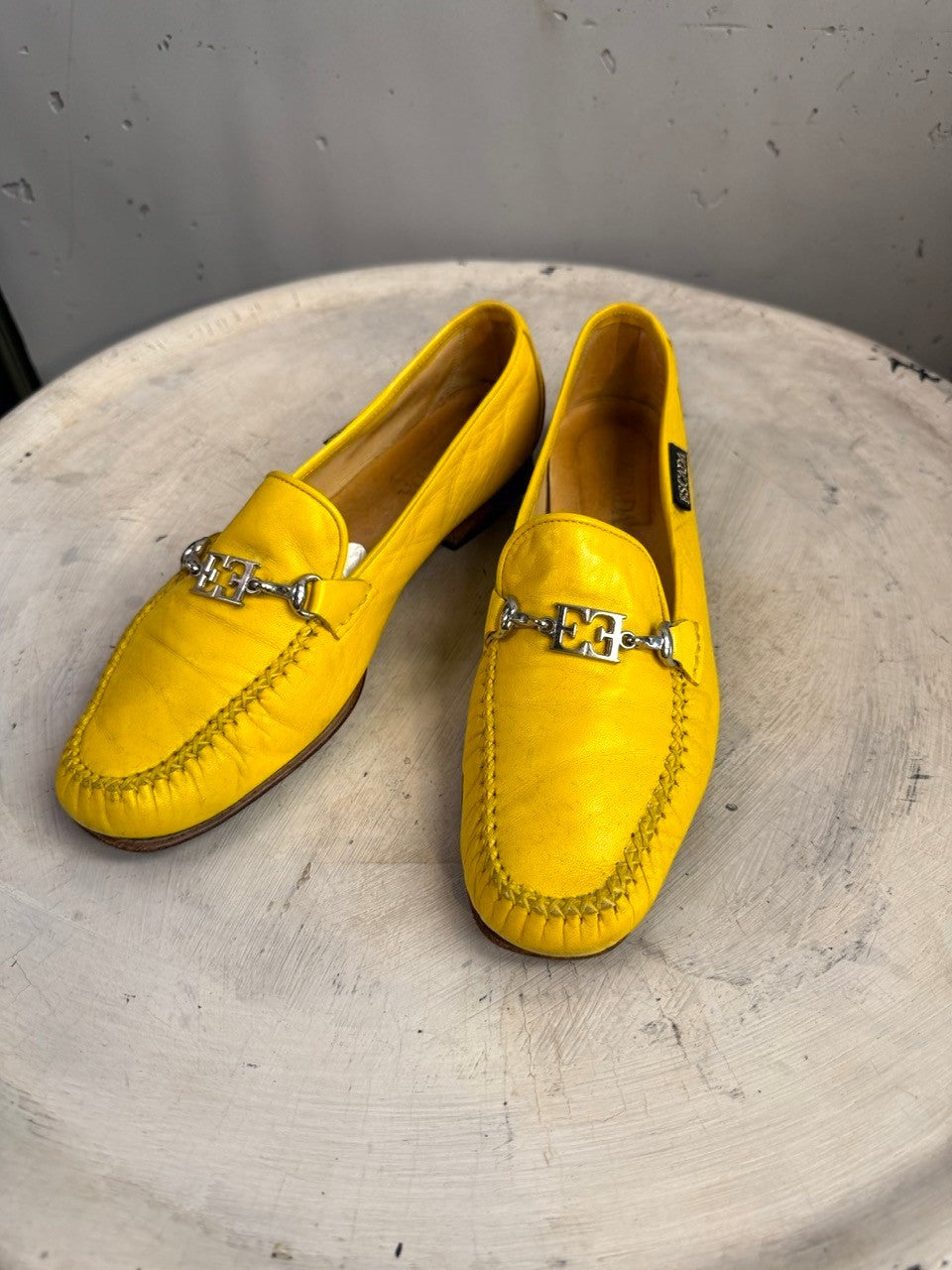 BERLIN VINTAGE CORNER yellow leather loafers with silver-tone metal accent and detailed stitching.