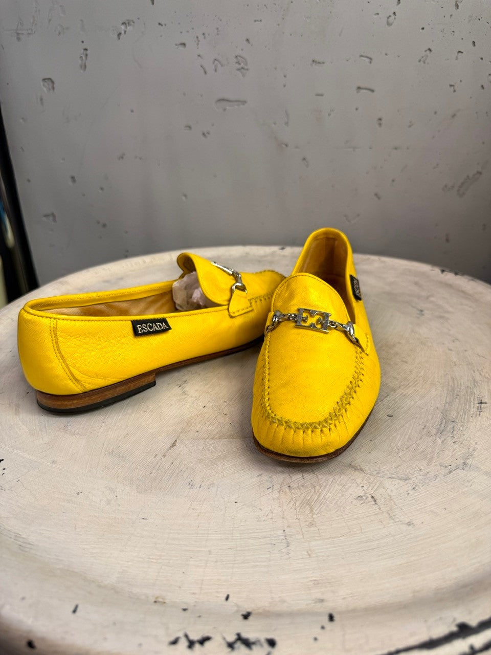 BERLIN VINTAGE CORNER yellow leather loafers with silver-tone metal accent and detailed stitching. Slip-on style.