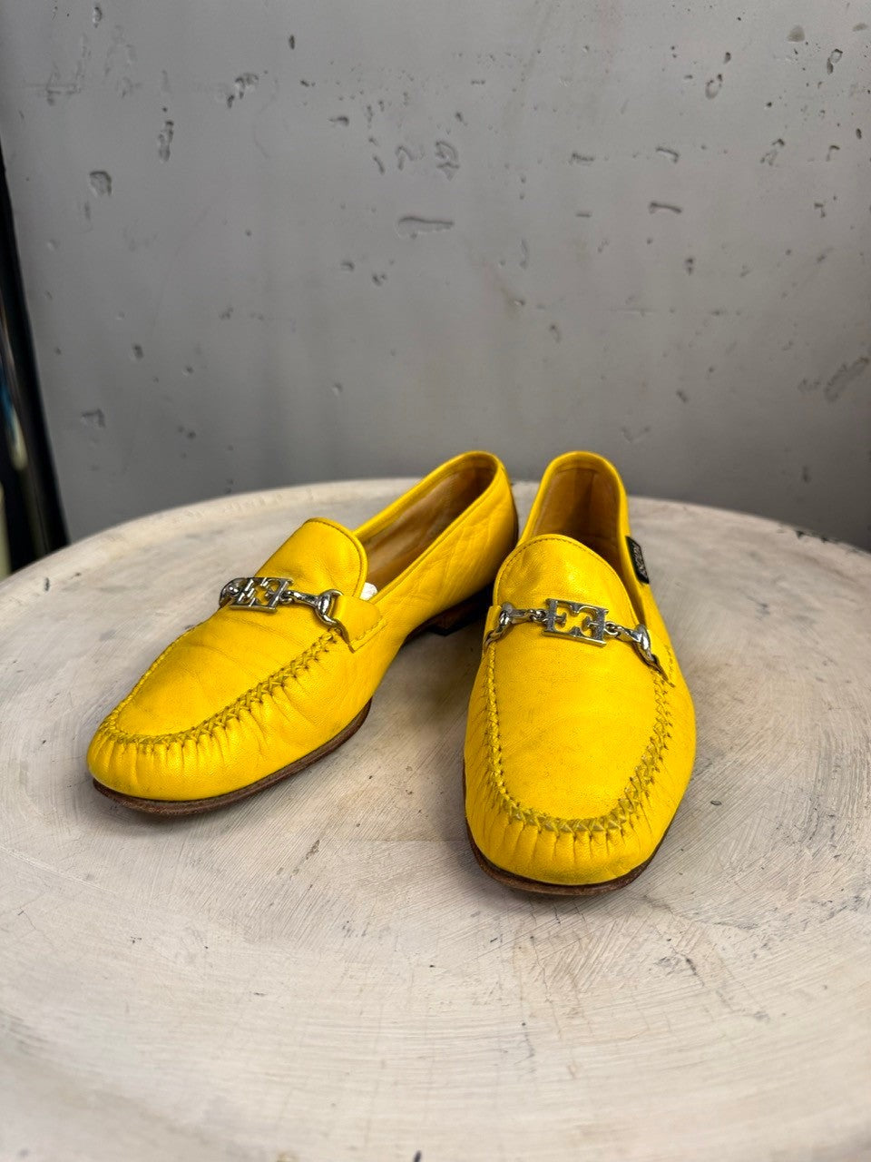 BERLIN VINTAGE CORNER yellow leather loafers with silver-tone metal accent and detailed stitching. Classic slip-on style.