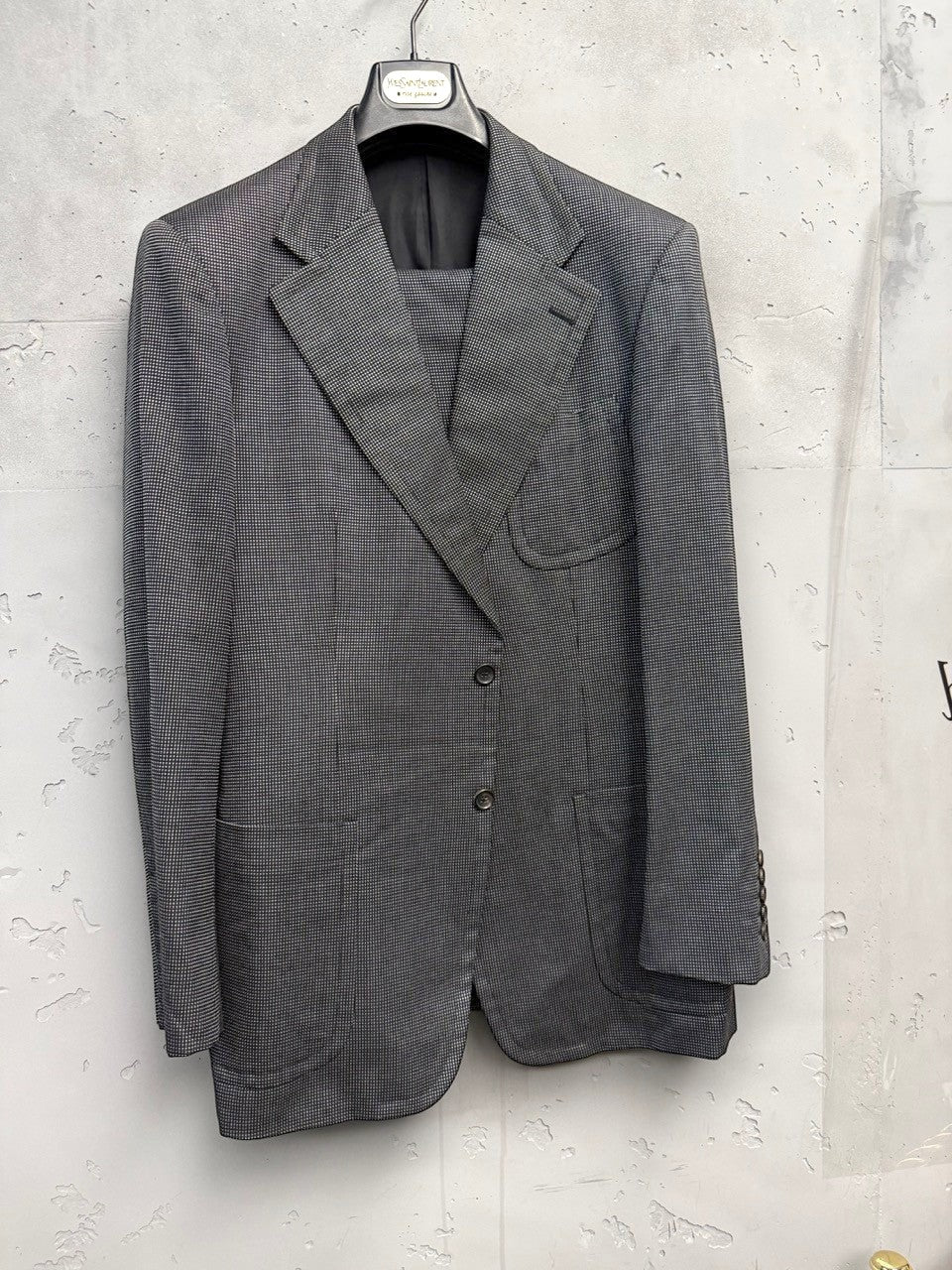 BERLIN VINTAGE CORNER Yves Saint Laurent Rive Gauche grey micro-dot wool blend suit. Features notched lapel, two-button jacket, and tailored trousers.