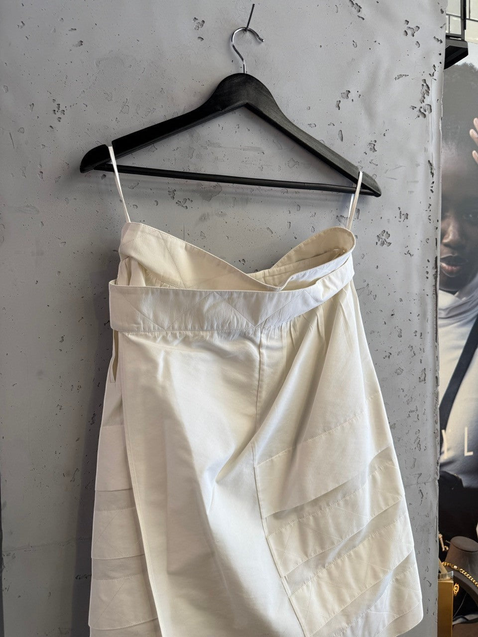 BERLIN VINTAGE CORNER off-white YSL Rive Gauche skirt with quilted waistband and black button details.