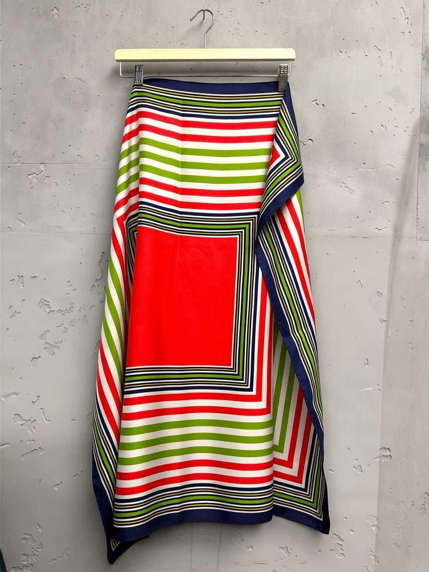 BERLIN VINTAGE CORNER Yves Saint Laurent red, green, white, and navy striped silk scarf with a central red square.