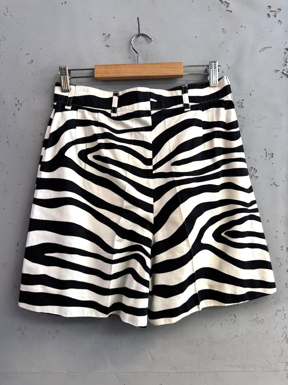 BERLIN VINTAGE CORNER black and white zebra print high-waisted shorts with pleated front and belt loops.