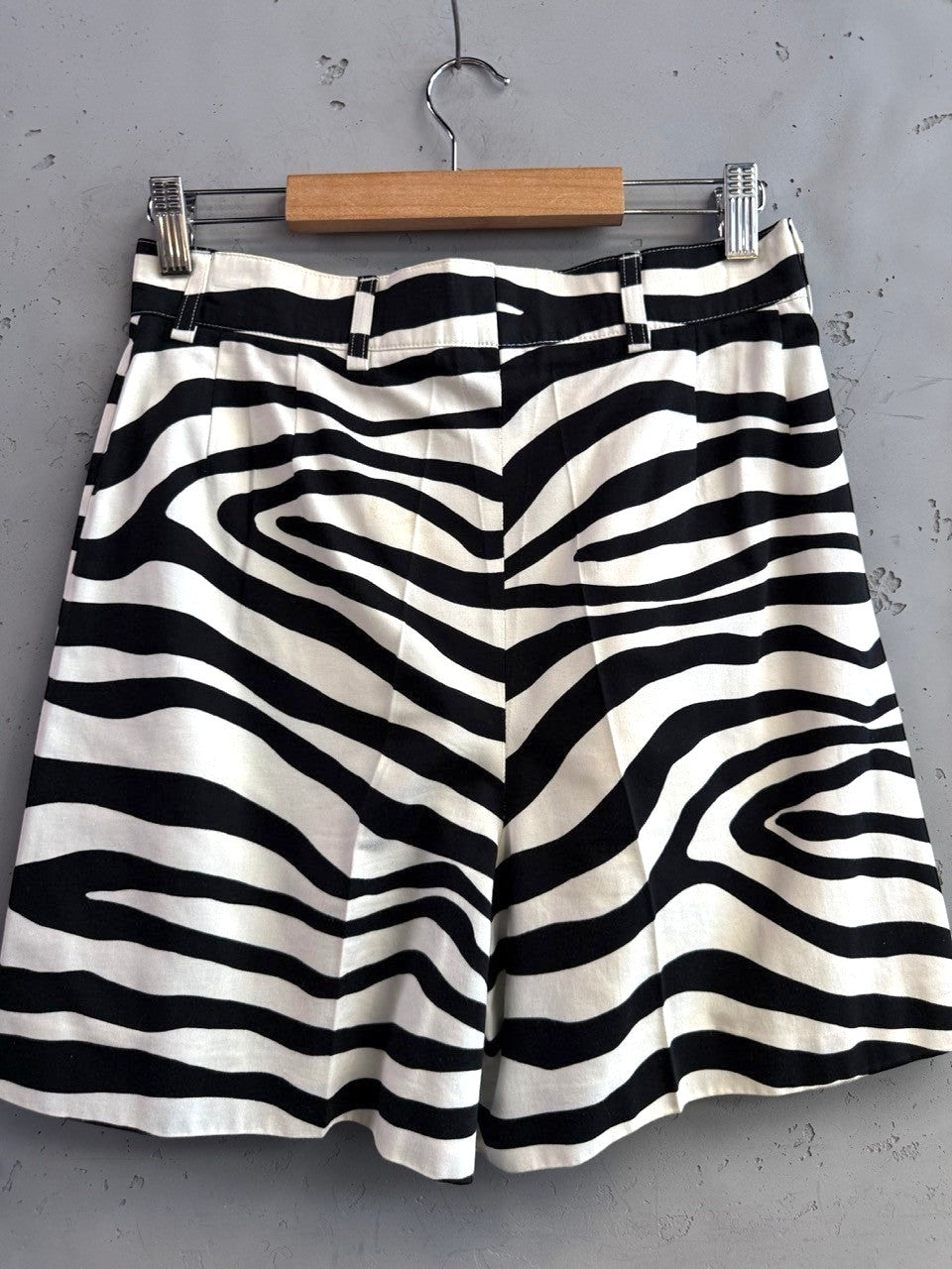 BERLIN VINTAGE CORNER black and white zebra print high-waisted shorts with pleated front and belt loops.