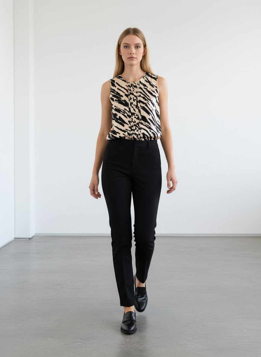 BERLIN VINTAGE CORNER sleeveless black and sand zebra print silk blouse with V-neck and front pleats.