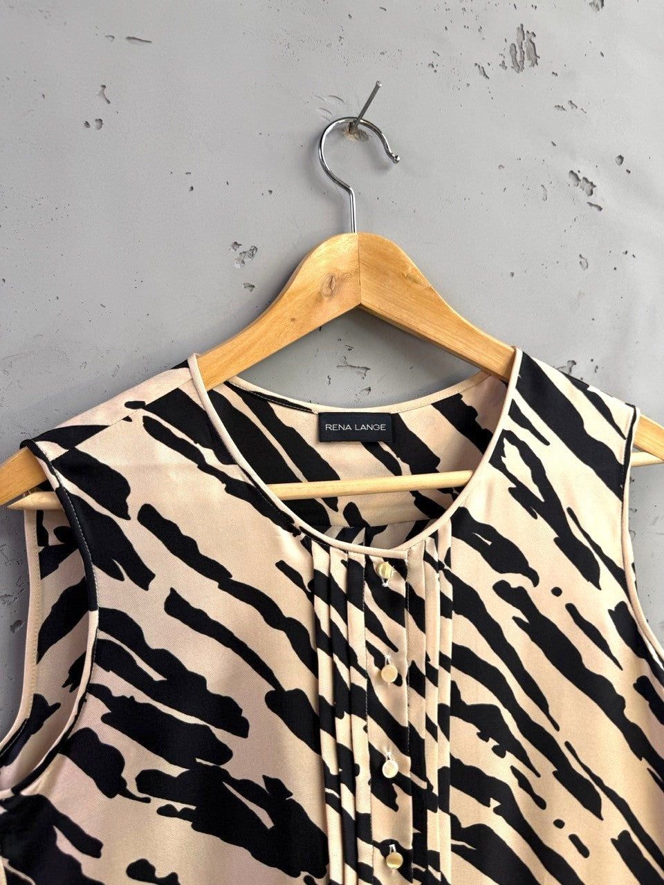BERLIN VINTAGE CORNER sleeveless black and sand zebra print silk blouse with V-neck and pleating.