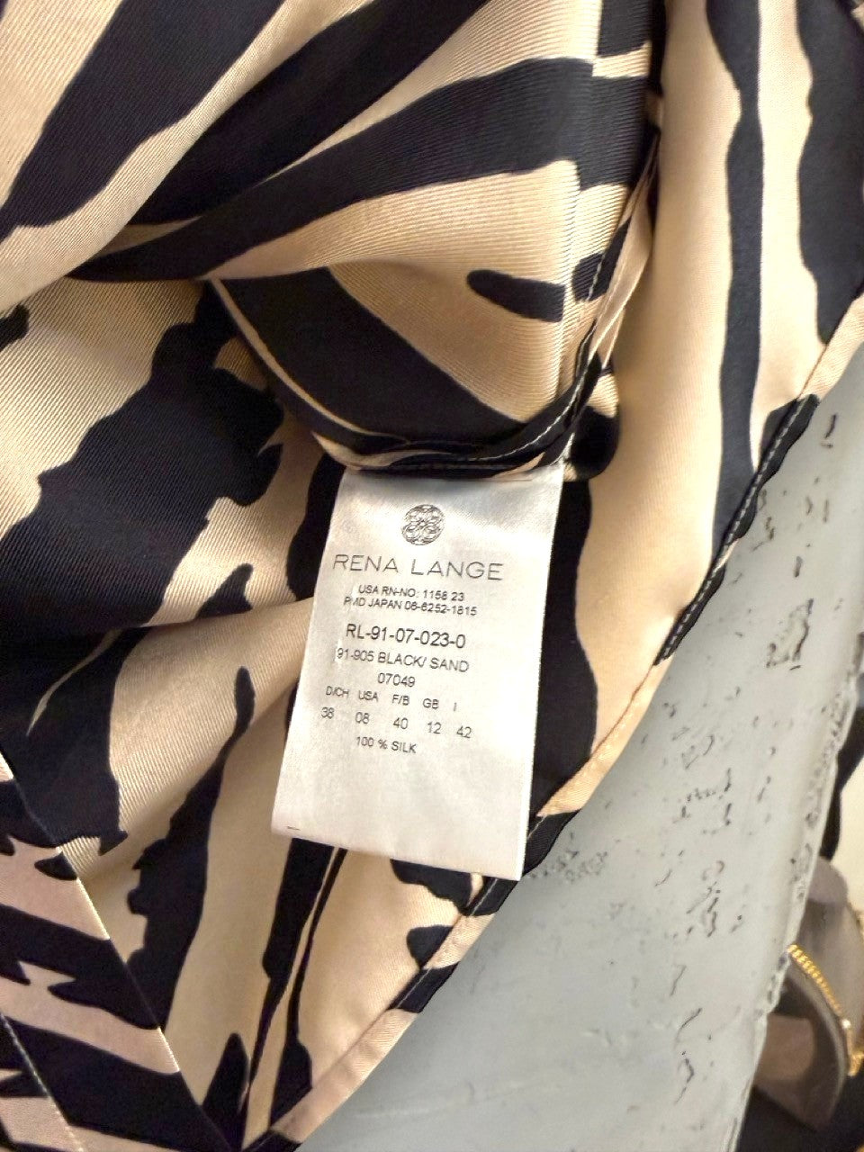 BERLIN VINTAGE CORNER black and sand zebra print 100% silk sleeveless V-neck blouse with pleating detail.