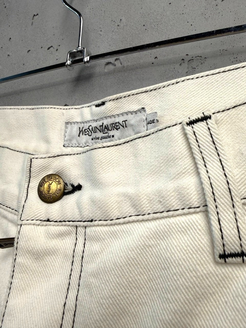 BERLIN VINTAGE CORNER off-white cotton wide leg jeans with black contrast stitching and YSL button.