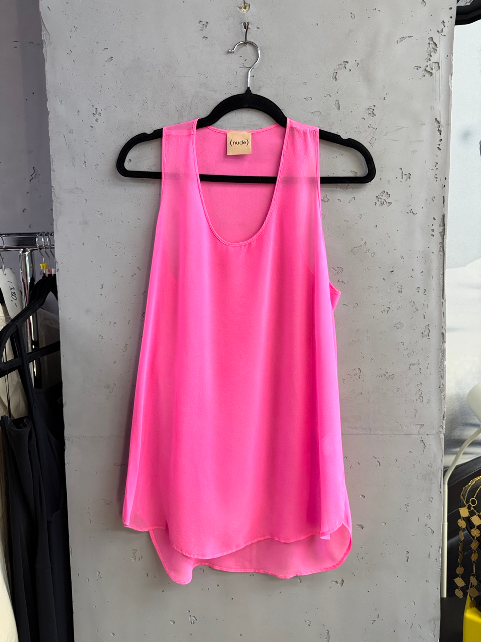 BERLIN VINTAGE CORNER Nude pink silk tank top, front view on a hanger